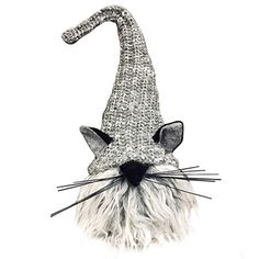 a black and white photo of a cat wearing a knitted gnome's hat