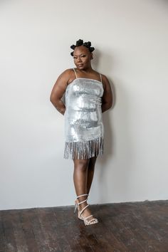 This Silver fringe dress will make you sparkle! Boasting silver sequins and beautiful fringe details, it’s perfect for any night out. Radiate elegance and light up the room in this beautiful dress. model 1 is wearing a large model 2 is wearing a small Glamorous Fringe Dress For Date Night, Fringe Mini Dress For Date Night And Party Season, Party Season Fringe Mini Dress For Date Night, Glamorous Beaded Fringe Dress For Date Night, Glamorous Fringe Dress For Prom, Glamorous Fringed Dresses For Prom, Glamorous Beaded Fringe Mini Dress For Night Out, Glamorous Mini Dress With Beaded Fringe For Night Out, Glamorous Beaded Fringe Night Out Dress