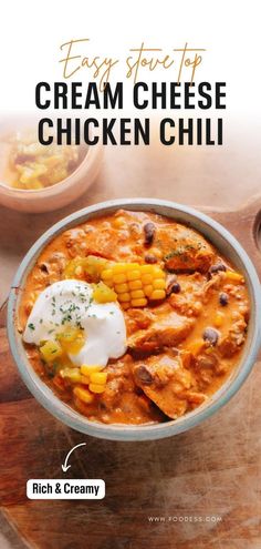 a bowl of chicken chili with sour cream on top