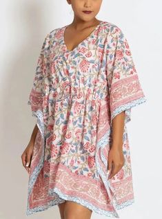 This soft 100% cotton caftan from Sevya makes a great swimsuit coverup or comfy dress! This breezy, lightweight, cotton caftan mini dress features an adjustable drawstring gather at the waist for whether you prefer a relaxed or fitted look. The material is hand stamped by artisans in Rajasthan, India. The wooden blocks are first hand-carved and the design is then hand-stamped using a different block for each color in the pattern. The seamless printing shows the fine skill of the block-printers, Bohemian V-neck Kaftan For Vacation, Beachy Flowy V-neck Kaftan, V-neck Floral Print Tunic For Beach Cover-up, V-neck Beachwear Kaftan For Poolside, Boho Print V-neck Beach Dress, Summer V-neck Kaftan For Beach Cover-up, Flowy V-neck Tunic For Beach Cover-up, Printed V-neck Kaftan For Beach Cover-up, Flowy V-neck Kaftan For Beach Cover-up