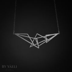 Triangle necklace – Beautiful geometric cluster of triangle necklace, its bound to be loved by the modern gal who loves fashion and minimalist design. ★ Comes in our signature gift box, ready for gift giving. ★ Available in Silver [Sterling silver chain & silver plated pendant] ★ Pendant size is 0.90"x2.80" . Thanks for shopping ... Minimalist Silver Triangle Necklace, Minimalist Sterling Silver Triangle Necklace, Modern Silver Geometric Necklace, Modern Silver Geometric Jewelry, Minimalist Geometric Sterling Silver Necklace, Minimalist Silver Geometric Jewelry, Geometric Silver Necklace For Gift, Silver Geometric Necklace For Gift, Geometric Sterling Silver Jewelry In Silver