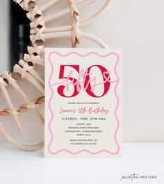 a pink and white 50th birthday party card with the number 50 on it's front