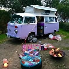 a camper van is parked in the dirt