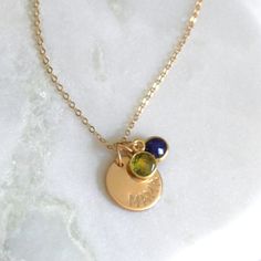 This special charm necklace is created with a mama and dainty birthstone charms. Available in silver or gold necklace options, this necklace is perfect for everyday and makes a unique gift for mom on Mother's Day!•6mm genuine natural birthstone•Choose up to 5 birthstones •12mm mama disc •100% 14kt Gold-Filled or Sterling Silver •A high quality delicate link chain with a spring clasp.•Polished to a light satin finish.•Great versatile design for everyday wear. Dainty Charm Necklace For Birthday, Everyday Yellow Gold Name Necklace With Birthstone, Adjustable Birthstone Name Necklace For Anniversary, Personalized Necklaces For Mom's May Birthstone, Hypoallergenic Initial Pendant Charm Necklaces For Mother's Day, Personalized May Birthstone Necklace In Yellow Gold, Personalized Yellow Gold May Birthstone Necklace, Personalized Gold Birthstone Necklace With Charms, Gold Birthstone Necklace With Charms For Personalized Gift