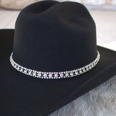 Silver and Rhinestone Bling Hat Band for cowgirls. Dress up your cowboy hat with this gorgeous hat jewelry!This rhinestone strand hatband comes with 3 layers of clear rhinestones set on silver metal. It is adjustable with a metal clasp in the back. Fits up to size 7 1/2 hat. * Hat not included. Adjustable Rhinestone Hat Bands For Party, Adjustable Rhinestone Hat Bands For Festivals, Adjustable Bling Hat For Country Events, Adjustable Western Jewelry For Party, Adjustable Western Style Party Jewelry, Adjustable Western Style Jewelry For Parties, Elegant Rhinestone Hats For Festival, Elegant Rhinestone Festival Hats, Western Rhinestone Hat Bands For Festivals