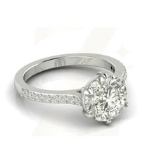 a white gold engagement ring with diamonds on the band and an oval shaped center stone