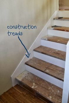 some stairs with construction treads painted on the side and an arrow pointing to them