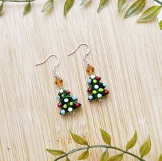 I T E M * D E S C R I P T I O N  🎄Cute mini christmas tree dangle earrings  -925 sterling silver hypoallergenic hooks  -1 inch drop length  -a perfect gift for a secret santa, coworker, or mom! ---------------------------------------------- Check out our other earrings here:  https://needfulthingsthrift.etsy.com?section_id=46781030 Check out our homepage here:  https://needfulthingsthrift.etsy.com M A T E R I A L S lampwork bead christmas trees, 925 sterling earring hooks, rubber backs for backs of earring hooks Please note, this item is handmade and may be slightly different each time it is made, But I assure that it is very close to what you see in photos All jewelry is handmade with love, designed and created by us. We are lovers of jewelry and fashion, that is why we put so much effor Santa Stocking, Handmade Jewelry Earrings, Christmas Tree Earrings, Bead Pendant, Mini Christmas Tree, Mini Christmas, Holiday Earring, Earring Tree, Holiday Trends