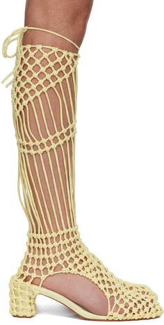 Knee-high stretch recycled nylon satin fishnet boots in yellow. · Knotted accents throughout · Self-tie fastening at collar · Cutout at sides · Logo patch at padded footbed · Covered block heel · Leather sole · Heel: H2.5 Supplier color: Yellow Yellow Fishnets, Isa Boulder, Group Project, Crochet Boots, Yellow Shop, Boots Knee, Boot Shoes Women, Bouldering, Knee High Boots