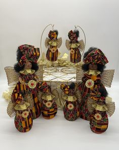 a group of dolls sitting next to each other