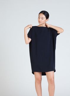 KAAREM - Angle Mini Dolman Open Back Dress - Black Blue Chic Short Sleeve Button Back Dress, Chic Short Sleeve Dress With Button Back, Oversized Mini Length Dresses For Daywear, Elegant Oversized Mini Dress, Mini Dress With Draped Sleeves For Work, Workwear Mini Dress With Draped Sleeves, Oversized Chic Knee-length Mini Dress, Chic Oversized Mini Dress, Oversized Mini Dress For Daywear