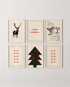 four christmas cards are hanging on the wall