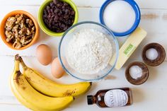 ingredients to make an oatmeal recipe laid out on a white wooden table