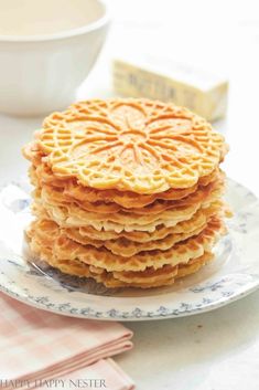 a stack of waffles sitting on top of a plate