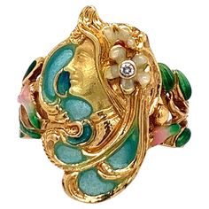 A beautifully crafted art nouveau ring made out of enamel and one round diamond weighing approximately 0.15 carat. The ring features a side profile of a lady. Total weight: 6.9 grams. Size 7.25-7.5. The lady's length is 2.1 cm. French Lady, Art Nouveau Ring, Nouveau Jewelry, Jewelry Boards, Art Nouveau Jewelry, French Women, Side Profile, Round Diamond, Women Rings