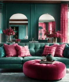 a living room filled with furniture and pink curtains