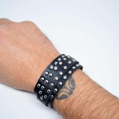 #Studded Mens Leather Bracelet #Adjustable Leather Bracelet Black #Mens Leather Bracelet #Studded Black Bracelet #Wrap Leather Bracelet #Mens Bracelet #Black Leather Bracelets #Studded Leather Wrap Bracelets #Women's Wrap Bracelets #Unisex Leather Bracelets #Black #Leather Jewelry #Hipster Bracelets #Mens Wrap Bracelets – edocollection Black Edgy Wristband With Studs, Trendy Black Bracelets With Rivets, Punk Style Leather Jewelry With Black Band, Punk Leather Jewelry With Black Band, Trendy Black Bracelets With Studs, Black Trendy Bracelets With Studs, Punk Leather Jewelry With Rivets, Black Leather Bracelet With Rivets For Concerts, Adjustable Black Wristband With Rivets