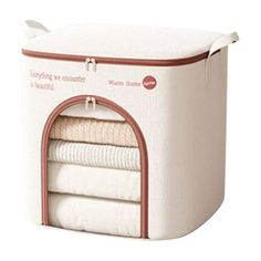 a white storage box with red trimmings and two folded towels in the bottom