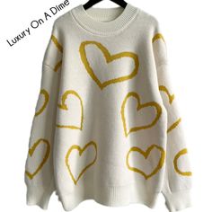 Knit Crew Neck Sweater With Heart Print, Trendy Heart Print Sweater For Winter, Trendy Fall Sweater With Heart Print, Cute Heart Print Winter Sweater, Cute Winter Sweater With Heart Print, Cute Heart Graphic Sweater For Fall, Cozy Winter Sweater With Heart Print, Cozy Heart Print Winter Sweater, Trendy Heart Graphic Sweater For Fall