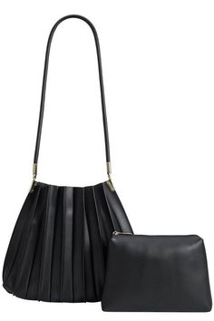 The bag of your dreams is here! Crafted from premium vegan leather, Carrie harmonizes an urban pleated design with classic shape, and gold hardware. This blend comes together to create a city-style essential. With Carrie's understated and refined glamour, she's your perfect companion for your every day and night adventures, complete with an inner matching pouch. Premium vegan leather with polyester lining Removable inner pouch One inner zip pocket Gold-tone hardware Imported Dimensions 10.5 "H, Party Bottoms, Melie Bianco, Round Handle, Straw Bags, Black Shoulder Bag, Shoulder Handbag, Fall Shopping, Fashion Essentials, Sneakers For Sale