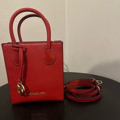 Never Used Michael Kors Handbag With Crossbody Strap Designer Red Box Bag With Handles, Luxury Red Square Bag, Designer Red Square Box Bag, Luxury Red Square Satchel, Luxury Red Crossbody Box Bag, Red Shoulder Box Bag With Gold-tone Hardware, Square Bags With Gold-tone Hardware For Shopping, Red Crossbody Box Bag For Shopping, Red Square Box Bag With Handles