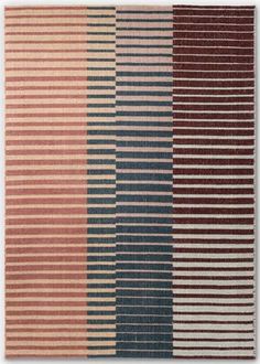 four different colored rugs with stripes on them