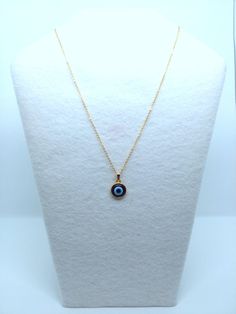 Evil Eye Pendants in Gold/Silver Tone. Cabochon bezel is hand-painted with Ultramarine Blue acrylic paint to enhance the charm. 12mm blue resin evil eye charm is resin set into alloy metal cabochon bezel. Chain length is 18 inches. Silver chain is stainless steel and gold chain is gold plated brass. Charm length and width is 1/2 inch. Has an upgraded lobster clasp closure on the back. Back of cabochon bezel is also coated in a protective UV gel to avoid tarnishing. Jewelry Cloth & Wear/Care Blue Metal Necklace With Evil Eye, Blue Metal Charm Necklace With Round Pendant, Blue Metal Evil Eye Necklace, Evil Eye Metal Jewelry For Gifts, Metal Evil Eye Jewelry For Gift, Evil Eye Metal Jewelry Gift, Blue Evil Eye Metal Necklace, Evil Eye Round Pendant Jewelry Gift, Metal Evil Eye Necklace With Round Shape