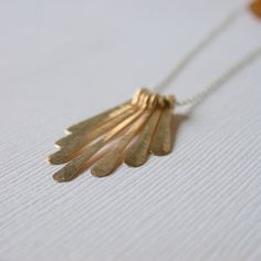 "Looking for a necklace you can wear on a run, in the shower, to work all week and still look great on your one night out in a month, this is it! No fuss, looks great. All of my jewelry is made with sterling silver and gold fill wire and findings, nothing is plated and the craftsmanship is guaranteed, so feel secure in purchasing this Petite Fringe necklace for yourself or as a special gift. I literally wear the same pieces for months and months, swimming, running, sleeping, bathing, breathing C Silver Long Drop Necklaces For Everyday, Everyday Silver Long Drop Necklace, Everyday Long Drop Silver Necklace, Minimalist Silver Brass Charm Necklaces, Mixed Metal Necklace, Minimalist Necklace Gold, Gold Fringe, Metal Necklace, Fringe Necklace