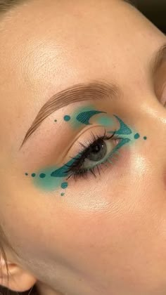 India Poulton on Reels | Oppidan · See Me Funky Blue Eye Makeup, Glam Makeup Looks Colorful, Effie Trinket Makeup, Monochrome Eye Makeup, About Face Eye Paint, Makeup Looks With Jewels, Wet Liner Looks, Eyeliner Designs Simple, Makeup Looks Graphic Liner