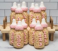 some rice krispy kreme bottles with pink frosting on them