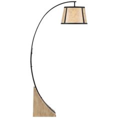 a lamp that is on top of a wooden table next to a white wall and floor