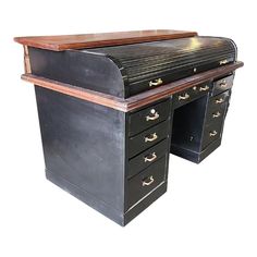 an old fashioned desk with two drawers