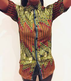 *Similar styles available in my store Free Complimentary Face Mask / Gift per order  Presenting a classic style but keeping its African appeal is The Yorubatik African Print Ankara Wax Print Short Sleeve Shirt. This 100% cotton shirt is made using fine African fabrication in a modern fit. It's a perfect complement to any tousers, or even your favourite denim. *Similar styles available in my store *100% medium weight wax print Cotton * No Pocket  *Chest Size approx 36" *Length - approx 28" *Sleev Multicolor Random Print Top With Short Sleeves, Casual Slim Fit Graphic Print Tops, Casual Slim Fit Tops With Graphic Print, Green Slim Fit Button-up Top, Green Slim Fit Collared Shirt, Cotton Short Sleeve Tops With Random Print, Multicolor Slim Fit Cotton Tops, Casual Multicolor Slim Fit Shirt, Casual Multicolor Slim Fit Tops