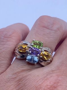 Lovely and delicate Bohemian ring  925 Sterling silver  Deco ring set with genuine citrine, amethyst blue topaz and peridot  Silver is tarnished with age and can be polished up.  Size 8 but can be re sized for you on request by laser.  My jeweler charges $20  All rings are shipped in a nice gift box.   Check out our over a THOUSAND great reviews Engraving is $4 per letter and is not always perfect depending on the piece. It can take a few days if the jeweler is busy. This is payable to Paypal Ju Multi-stone Citrine Gemstone Ring, Multi-stone Citrine Gemstones, Multicolor Sterling Silver Topaz Ring For Anniversary, Multi-stone Amethyst Ring As A Gift, Multi-stone Topaz Gemstones As Gift, Multicolor Amethyst Rings For Anniversary, Sterling Silver Multi-stone Topaz Ring For Anniversary, Multicolor Amethyst Ring In Sterling Silver For Anniversary, Multicolor Amethyst Sterling Silver Ring For Anniversary