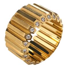 A sleek, architectural statement band from Geoffrey Good. Geoffrey has created and restored magnificent jewels for firms and museums including Cartier, Christie's, Sotheby's, Taffin, Verdura, Fred Leighton and The Metropolitan Museum of Art in NYC. Solid 18k yellow gold hexagonal bars encircle the finger with iconic style. (44) diamonds are set into the mitered edges for a look that's both luxe and understated simultaneously. .66 carats total per ring at size 7 shown. Also available here in 7mm Luxury Channel Set Baguette Cut Jewelry, Luxury Jewelry With Single Cut Diamonds In Wide Band, Luxury Wide Band Jewelry With Decorative Band, Luxury Wide Band Jewelry With Single Cut Diamonds, Modern Formal Jewelry With Decorative Band, Luxury Formal Jewelry With Decorative Band, Luxury Yellow Gold Bands For Formal Occasions, Modern Jewelry With Decorative Band For Formal Occasions, Luxury Diamond Ring With Decorative Band