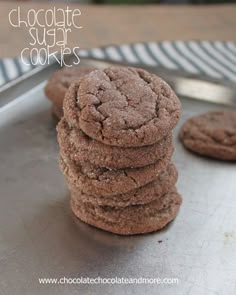 chocolate sugar cookies stacked on top of each other