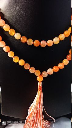 108 Beads/AAA Natural Orange Jade Round Beads Highly Polished Japa Mala Prayer Beads Japa Mala Guru bead Necklace,Jewelry Making Crafts For Gift Stone :Natural Orange Jade Shape :- Round Size :- Approx 8mm Polish :- Handmade Purity :- 100% Natural Gemstone color - Orange Color makes a great gift for your loved ones. It is known as the 'love stone' as the message it emits is the strong vibration of unconditional love, joy, warmth and healing. As quartz crystals are profound amplifiers of energy, Handmade Orange Beaded Bracelets For Meditation, Spiritual Hand-strung Amber Beaded Necklaces, Hand-strung Amber Beaded Bracelets For Meditation, Orange Bohemian Beaded Bracelets With 8mm Beads, Amber Beaded Bracelets For Meditation, Orange Gemstone Beaded Bracelets For Meditation, Hand-strung Orange Bohemian Beads, Orange Polished Beads Bracelet, Bohemian Hand-strung Orange Beads