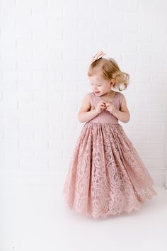 "This stunning dress is a beautiful vintage inspired look...perfect for any little girl and occasion! This mauve/rose dress has a boho flair and a super feminine feel with the soft vintage inspired lace. The V back with unfinished lace and hem creates the perfect amount of bohemian vibes. Nicolette's Couture is a family owned boutique based out of Dubuque, Iowa. When creating looks, comfort is our main priority...regardless of how chic a style is. We've had amazing success so far and believe our Gatsby Flower Girl Dress, Blush Tulle Wedding Dress, Girls Christening Dress, Flower Girl Dresses Short, Wedding Dress Rustic, Ophelia Dress, Rose Wedding Dress, Dubuque Iowa, Wedding Dress Beach Wedding