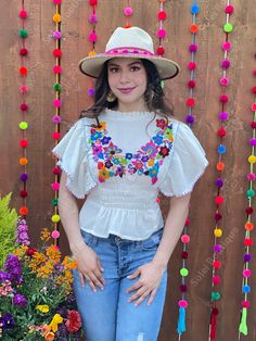 This beautiful Flounce Sleeve Top is the perfect Top for a fun day out or special event. The adorable fluttery sleeves and colorful hand embroidered flowers make it flirty and fun. It's made out of fine Mexican cotton, has an elastic waist and has colorful flowers embroidered completely by hand. This blouse is made with love by Mexican Artisans in Chiapas, Mexico. Please note: This blouse comes in one size which fits sizes Small and Medium. Purchase the Mexican hats here: https://www.etsy.com/es Summer Festive Blouse With Floral Embroidery, Festive Floral Embroidered Summer Blouse, Festive Floral Embroidered Blouse For Summer, Spring Festive Embroidered Short Sleeve Top, Festive Spring Embroidered Top With Short Sleeves, Festive Embroidered Short Sleeve Top For Spring, Spring Festival Multicolor Blouse, White Festive Top For Summer, White Hippie Peasant Top For Summer