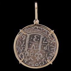 Atocha Round 8 Reale Silver Coin Pendant Item Number - ST-7003P Frame - Solid 14K Gold Medium Wrap with Large Bale Dimensions - 1 1/4" diameter (about the size of half-dollar) Weight - 11.8 grams Now You Can Own a Piece of History! Atocha Silver is More Pure than Sterling Silver! The silver coin was hand cast using a formulated blend of silver ingots recovered from the Sunken Treasure of the Nuestra Senora de Atocha and fine Sterling Silver. The Nuestra Senora de Atocha (Our Lady of Atocha) Span