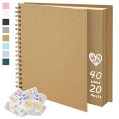 a brown notebook with stickers next to it and the book cover is open, showing 40 pages