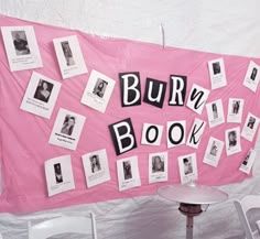 there is a pink sign with black and white pictures on it that says burn book