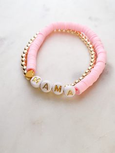 "ABOUT THIS PIECE:  Beautiful \"Mama\" pink/white/gold ceramic bracelet and round gold acrylics bracelet. Simple, cheerful and fashionable. Fits most wrists. Stretchy, top-grade elastic. When laid out flat, the diameter is 6\" - standard women's wrist size.  Wear them in their own, together or layered with your other favourites. I also offer these stacked bracelets in lots of other colour combinations in my shop:  https://www.etsy.com/ca/shop/RubyBlueCo Here are the other products in my shop:  h Custom Name Pink Stretch Bracelet, Custom Name Pink Adjustable Bracelets, Customizable Adjustable Pink Stretch Bracelet, Adjustable Customizable Pink Stretch Bracelet, Personalized Pink Stackable Bracelets, Pink Stackable Bracelets For Birthdays, Pink Stackable Bracelets For Birthday, Personalized Pink Stretch Bracelet, Customizable Pink Bracelets For Mother's Day