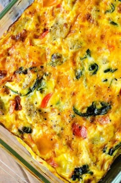 a casserole dish filled with vegetables and cheese