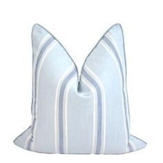 a blue and white striped pillow on a white background