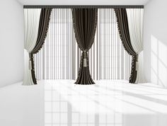 an empty room with black and white curtains