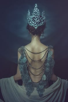 the back of a woman wearing a tiara