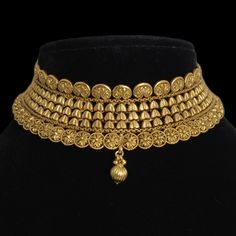 India Gold Necklace, a dazzling piece of Temple Jewelry. This Choker Necklace exudes timeless elegance and is ideal for weddings and special occasions. Crafted in the South Indian tradition, it reflects the rich heritage of Temple Jewelry. Adorn yourself with the intricate designs of this Temple Necklace Set, perfect for making a statement. Whether it's a wedding or a grand celebration, this piece adds a touch of sophistication to your ensemble. *𝐏𝐑𝐎𝐃𝐔𝐂𝐓 𝐃𝐄𝐓𝐀𝐈𝐋* * Material: Brass * Wedding Jewelry Sets With Filigree, Wedding Filigree Jewelry Sets, Gold Plated Necklaces For Marriage, Gold Plated Round Jewelry For Wedding, Ornate Bridal Necklace With 17 Jewels, Elegant Heavy Bridal Choker Necklace, Traditional Gold Necklaces For Wedding, Traditional Gold Necklace For Wedding, Elegant Choker Jewelry With Intricate Design