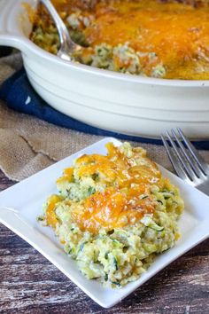 a casserole dish with broccoli and cheese on it next to a fork