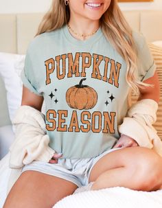 Embrace the cozy charm of fall with our Vintage Pumpkin Patch Tee! This adorable shirt features a nostalgic pumpkin design that brings back all the feels of crisp autumn air, hayrides, and harvest festivals. Made from soft, breathable fabric, it's perfect for layering under your favorite flannel or wearing on its own for a casual, cute look. Celebrate the season in style with this timeless piece that's sure to become your go-to fall favorite! Retro Orange T-shirt For Fall, Soft-washed Casual T-shirt For Fall, Cute Fall T-shirt With Relaxed Fit, Fall Graphic Tee Soft-washed, Retro Orange Tops For Fall, Casual Crew Neck Tops For Thanksgiving, Vintage Relaxed Fit T-shirt For Fall, Retro Graphic Print Tops For Fall, Retro Cotton Tops For Fall